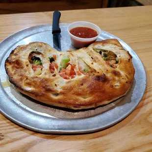 Calzone with broccoli and pineapple.