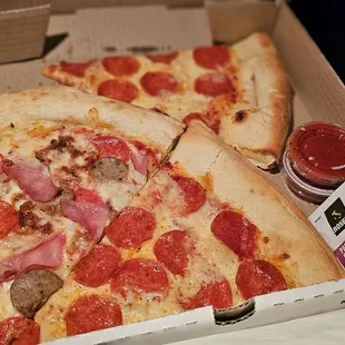 two slices of pizza in a box