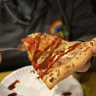 Joezilla--BBQ marinara, feta, roasted chicken, red bell, red onion, BBQ Sriracha drizzle