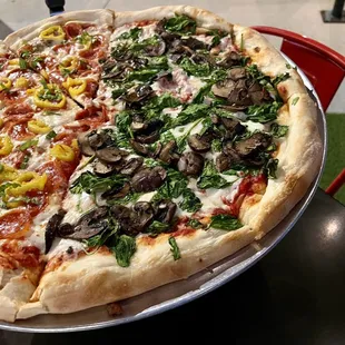 They do 1/2 &apos;n 1/2 pizzas! This is 1/2 fungus among us 1/2 custom pepperoni, banana peppers, basil.  September 2023