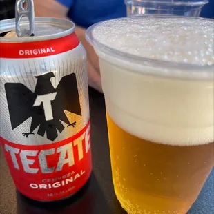a can and a glass of beer