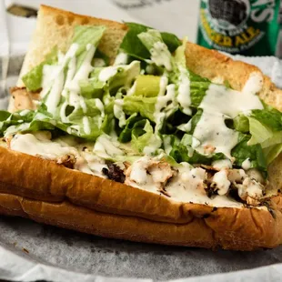 Chicken Caesar Hero: Chicken Breast Sauteed in Italian Dressing topped with Mozzarella, Caesar Dressing and Romaien Lettuce