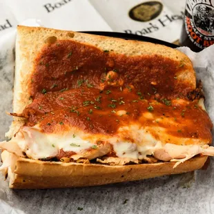 Chicken Parmesan: Sauteed Chicken Breast smothered in house made Marinara and topped with Melted Mozzarella on a toasted Italian Roll