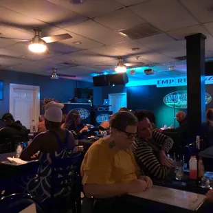 a crowd of people sitting at tables