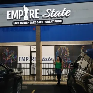 a woman standing in front of the entrance