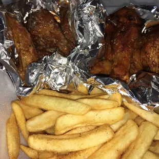Half Spicy Garlic Parmesan and Half Spicy Lemon Pepper with fries