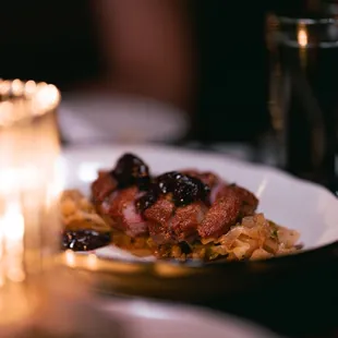 Roasted Duck Breast - cherry gastrique, togarashi, brown butter cabbage