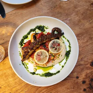 a plate of food on a wooden table