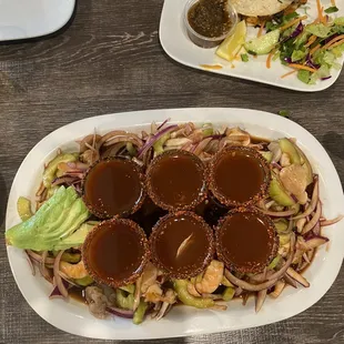 Oyster shooters and Mariscos around it with 2 governador tacos both delicious