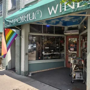 Emporium Wines &amp; Underdog Cafe features an extensive wine collection, Cafe, espresso bar, bakery, breakfast, and an inclusive atmosphere.