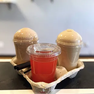 a container of juice and a container of ice cream
