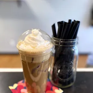 a cup of iced coffee and strawberries