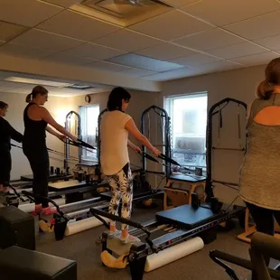 Squats and upper body workout on the reformer.  Nice job!