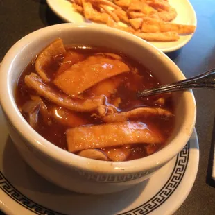 Sweet &amp; sour soup with fried wontons.