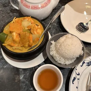 Jasmine hot tea and shrimp Thai red curry. So good, highly recommended.