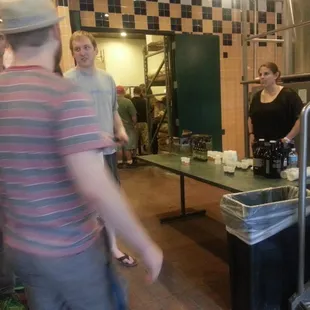 a group of people in a kitchen