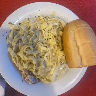 a plate of pasta and bread
