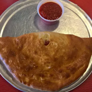 Original Italian Meats calzone with a side of homemade marinara...so good!