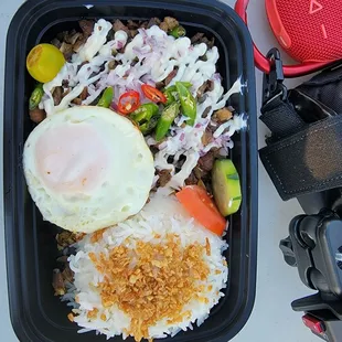 Pork sisig, garlic rice topped with egg