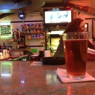 a pint of beer on the bar