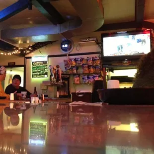 two people sitting at a bar