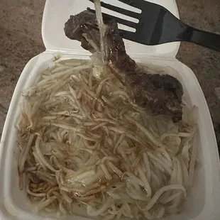 Short rib (1) rice plate with pan fried noodles.