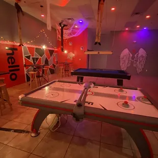 a game room with a ping pong table