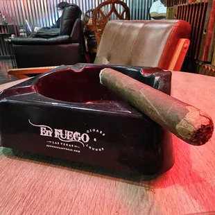 a cigar in a cigar ashtray