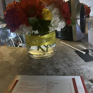 Fresh cut flowers decorate the bar at en fuego