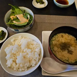 Additional rice, miso soup, salad, and Japanese pickles