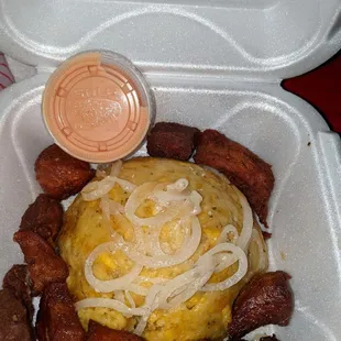 a meal in a styrofoam container