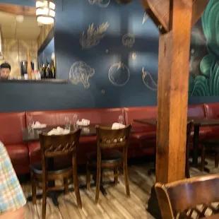 a man sitting at a table in a restaurant