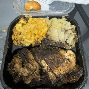 Jerk chicken, Mac and cheese and cabbage, fried dumpling.