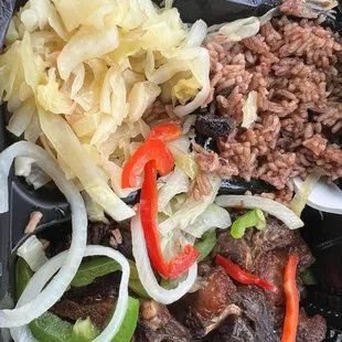 Oxtail dinner plate: rice and peas, and cabbage