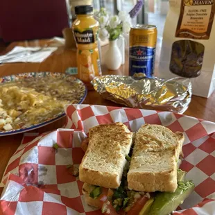 Enchilada, gluten free breakfast sandwich, and breakfast burrito