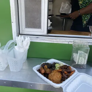 Combo Plate: Jerk Chicken with Lamb, Delicious fried cabbage. Jollof rice is a must try and a nice portion of fried plantains.