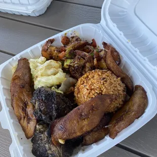 Combo plate: Super tender and flavorful Jerk Chicken with sautéed shrimp with veggies, fried cabbage, and plantains. MUST TRY!!