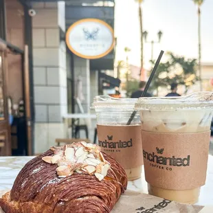 Almond Croissant, Iced Duo Coffee Latte, and Iced Honey Oat Latte.