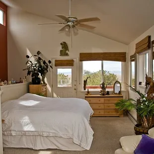 The second story Master Bedroom Suite of Enchanted Forest Accommodation in Crestone CO with amazing view of the San Luis Valley