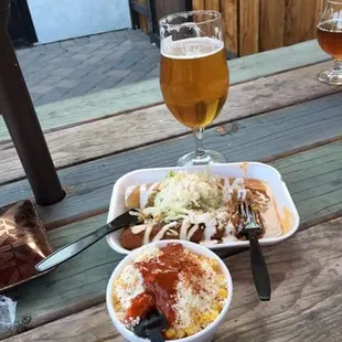 a plate of food and a glass of beer