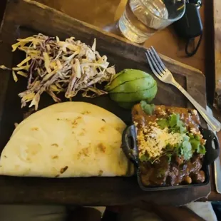 Goat Guisada Tacos with fermented fresno chile slaw, oak cliff tortillas, avocado