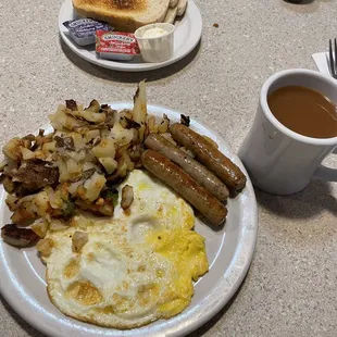 Two eggs, sausage links, and home fries