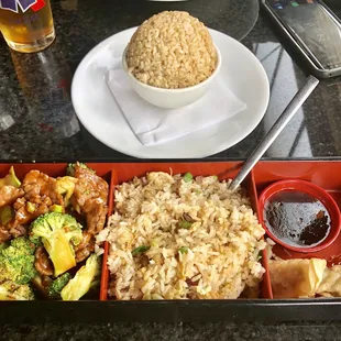 small bento with beef and broccoli, fried rice, gyoza and sauce (my husband's brown rice behind)