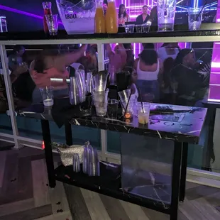 a bar with people in the background
