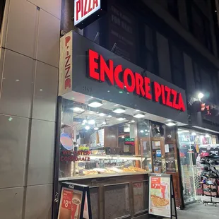 the entrance of a pizza restaurant