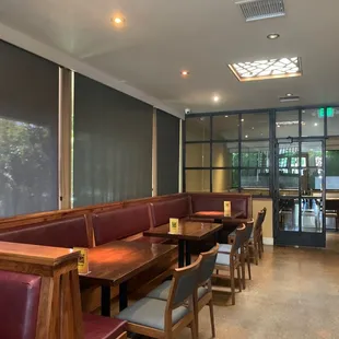 a restaurant with booths and tables