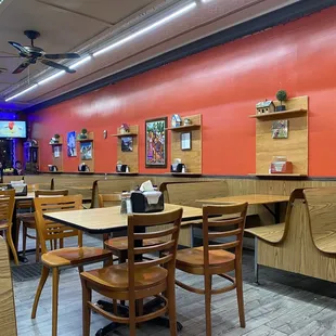 a restaurant with tables and chairs