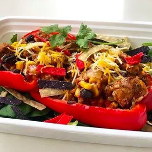 Taco Bell Pepper filled with lean ground turkey, black beans, quinoa, roasted corn, and topped with low fat cheese and crispy tortilla bits.