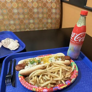 a plate of hotdogs and french fries