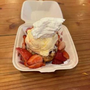 Fresh strawberry funnel cake with vanilla ice cream
